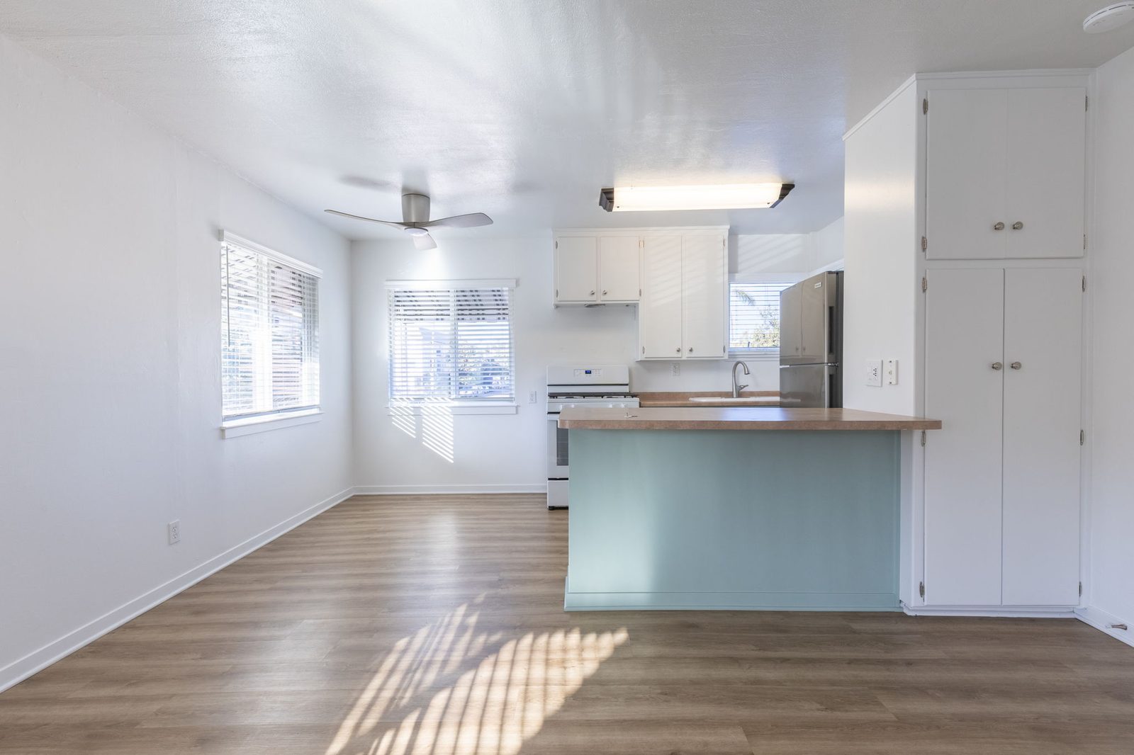 The kitchen peninsula in Apartment 1, with the pantry cabinets beside it